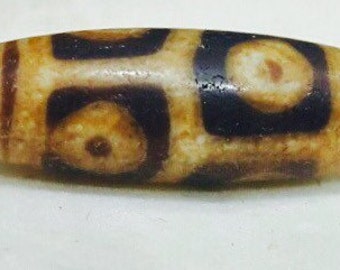 Ancient dzi bead from Himalaya with 6 eyes.