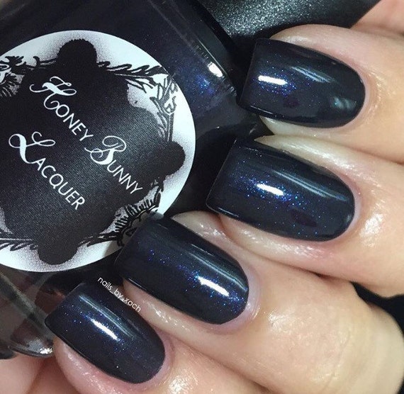 Black Gives Way To Blue black nail polish blue shimmer
