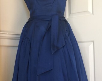 Beautiful vintage 1950s Mad Men-style midnight blue duchess satin dress