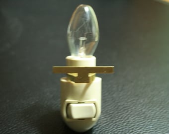 Nightlight assembly with brass glass attachment
