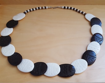 brown and cream coloured etched bone necklace