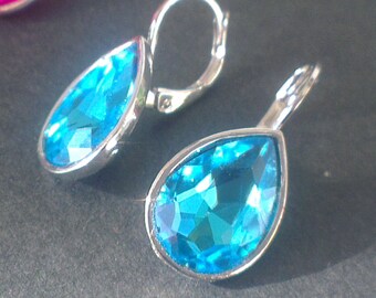 Small drops bright blue or pink (14 X 10 mm)