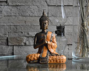 Petite sculpture de Bouddha en résine finition bronze-orange, fait à la main à Bali. Visitez notre nouvelle boutique Etsy !