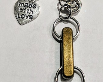 Handmade keychain with gold,bronze, and silver accent charms and beads chinese crested charms