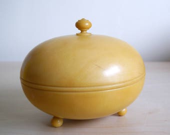 1920’s celluloid powder bowl and puff, very rare