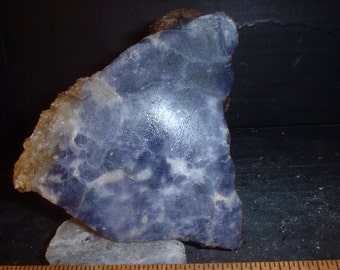 Dark Blue Scapolite End Cut in a mica matrix and Polished on one side.