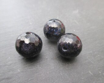 Blue sand stone: 2 round beads faceted 14 mm