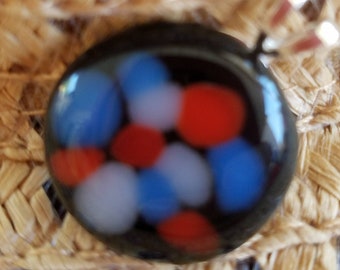 Black, blue and red fused glass pendant.