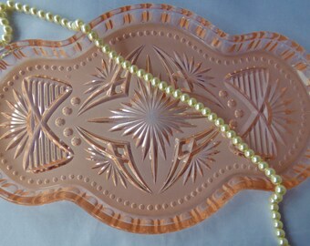 A lovely vintage Art Deco pale peach glass dressing table tray. Perfect for standing perfume bottles, make up or jewellery.
