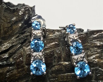 14 Karat White Gold Blue Topaz & Diamond Studs