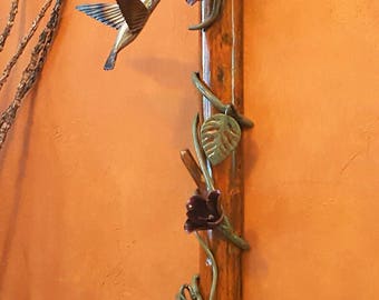Hummingbird - flowering vine on branch