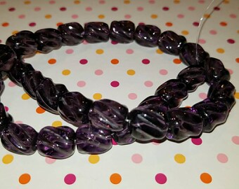 Glass swirl beads amythest color