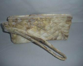 Beige and cream colored wristlet