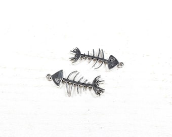 2 charms silver metal fish skeletons approximately 42 x 20.8 mm
