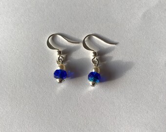 Earrings with blue faceted glass beads.