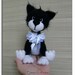 black and white soft toy cat