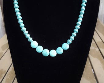 Turquoise necklace with flat and round beads
