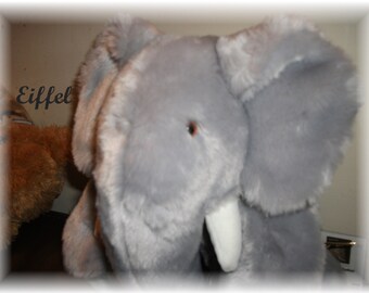 Eiffel Elephant is a 13 inches Handdewn One-of a Kind with sound box