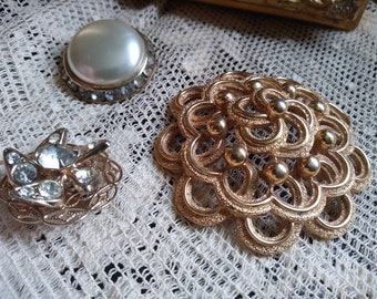 Vintage fancy brooches.all 3