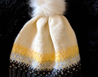 Patterned knit hat with removable pom pom