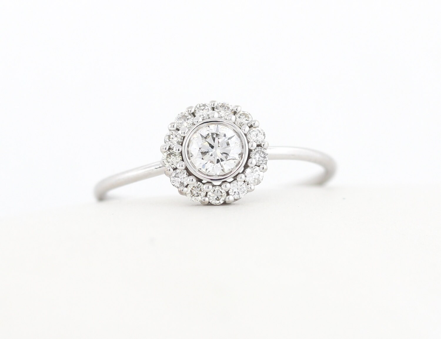 radiant cut hidden halo engagement ring