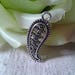 set of 5 carved silver charms