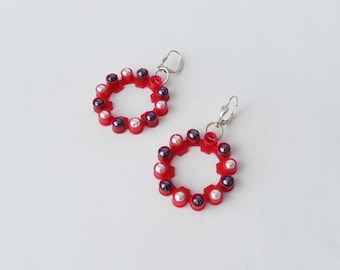 Bright red earrings made of plastic and sterling silver