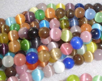 10 MIXED ŒIL CAT OPAL 6MM ROUND BEADS.