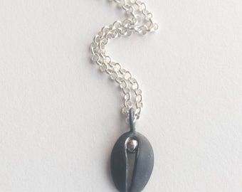 One of a kind oxidized silver contemporary vulva pendant.