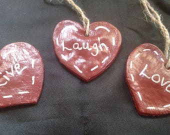 Heart Shaped ornament with the saying Love