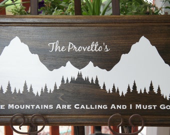 Personalize Cabin family name wall wood plaque sign - The Mountains Are Calling and I Must Go.Wedding Registry Dark stain with vinyl 22x11