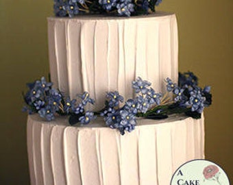 Fake cake with rustic icing for home staging, dessert buffet decor, and wedding centerpieces. 5" and 7" tiers, two tiered faux cake.