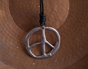 Aluminium large Peace symbol medallion on heavy leather strap