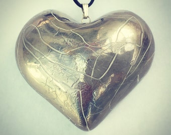 Large silver heart pendant.