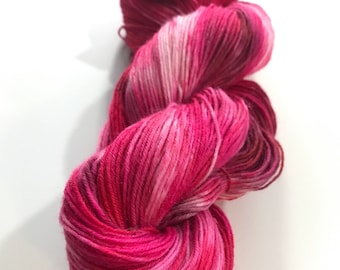 Hand dyed Merino and silk sock yarn in 50 shades of red.