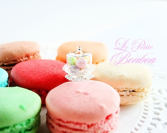 Assorted Macarons on a cake dome ring