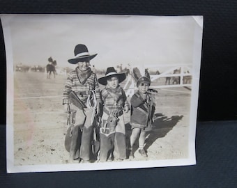 snapshot children playing cowboys and Indian
