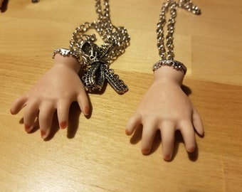 Silver capped Ceramic Doll Hand Necklace