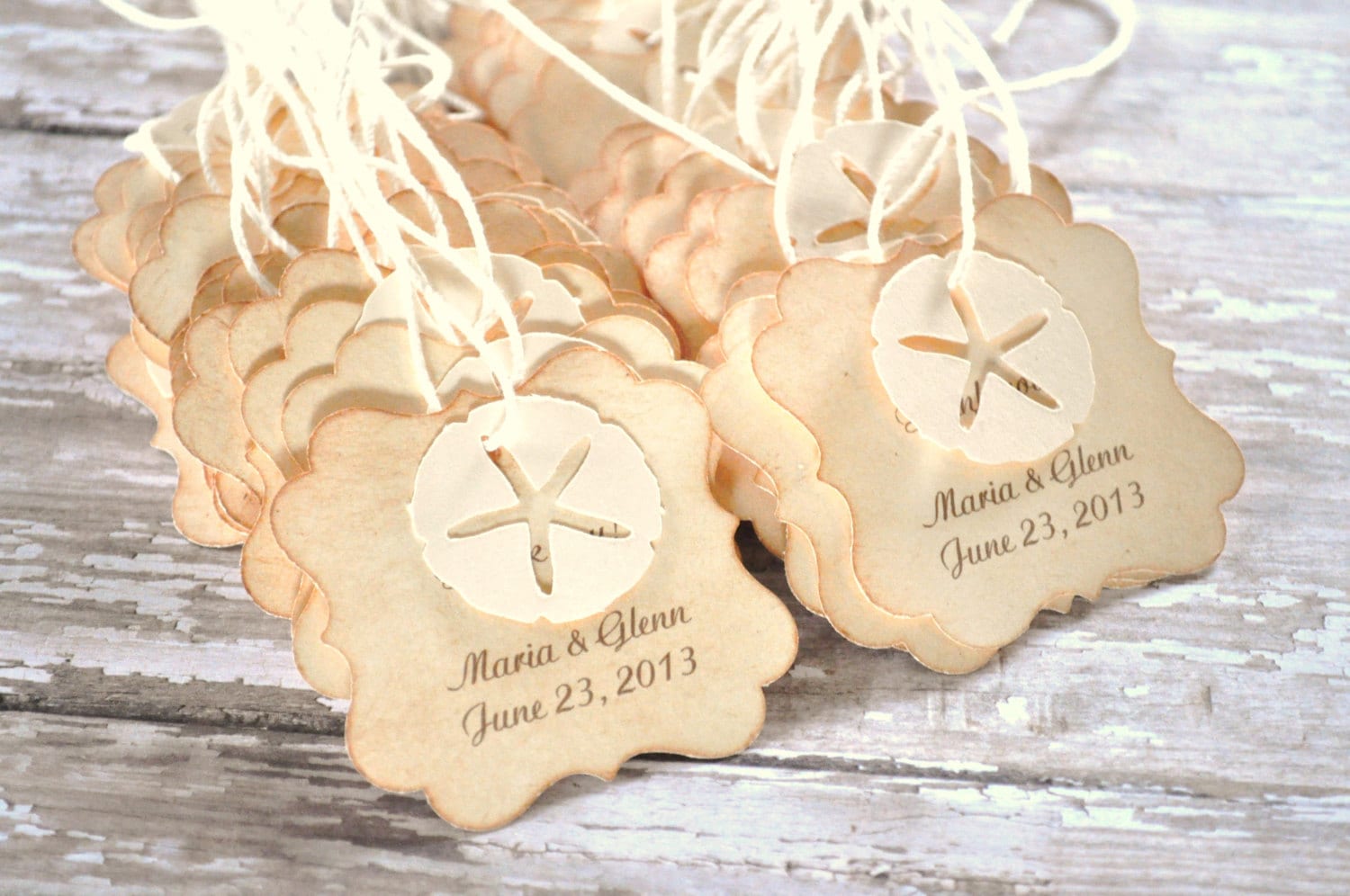 This is a set of 48 wedding favor tags. They measure approx. 2x2 inches. They are perfect for your beach theme wedding. They feature your names and wedding date