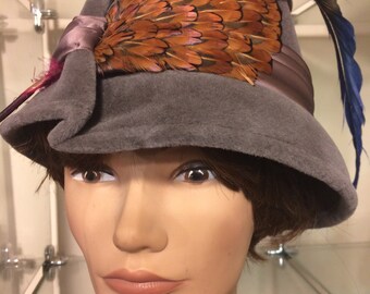 Gray Corona with feather hat