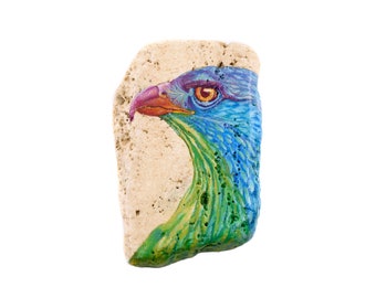 Hand-painted rock travertine pebble with a falcon