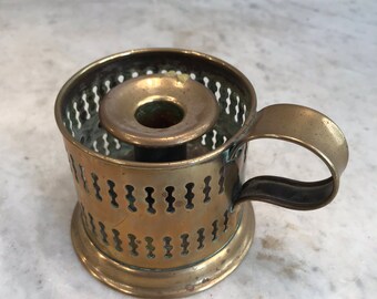 Antique brass candle holder with fretwork decoration