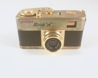 Spy Camera, Golden Ricoh 16 Camera, Leather Case. Subminiature, 1950s, Early 1960s Miniature Camera, Golden Ricoh Steky 16, Hard Shell Case