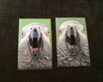 Hand-painted parrot "tongue" switch plate covers.
