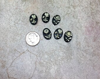 Tiny, resin unset black cameos with flowers. Vintage Hong Kong 4 pieces