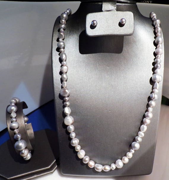 3 feet of Silver Freshwater Pearls with stud earrings and bracelet