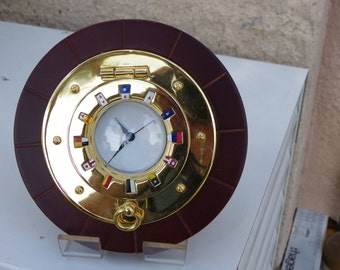 brass frame with a horloqe 15 cm with colored enamels