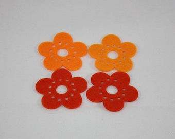 Embellishments/applique/subjects in felt flowers orange and rust