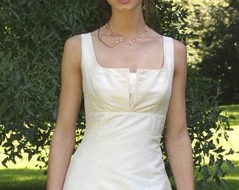 Simple cut wedding gown with pleated neckline