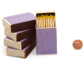 Five matchboxes, wooden matches with yellow heads inside, striker from two sides